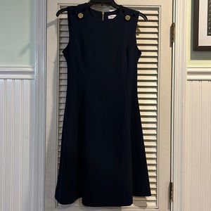 Blue sleeveless dress with gold button detail